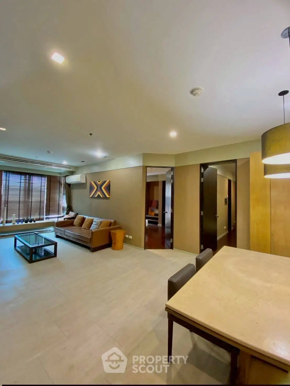 Spacious modern living room with elegant decor and ample natural light