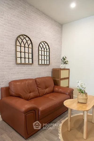 Cozy living room with leather sofa and stylish decor
