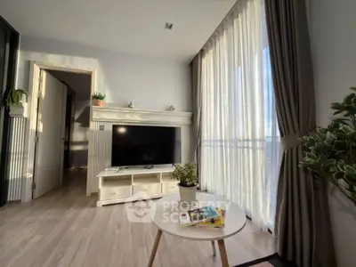 Bright and modern living room with large windows and stylish decor