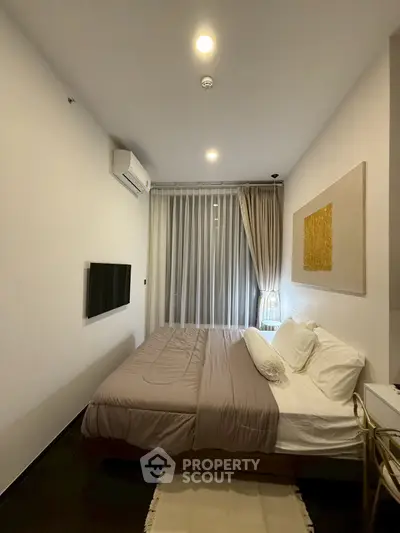 Cozy modern bedroom with stylish decor and natural light