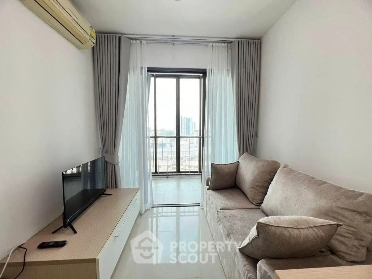 Cozy living room with modern sofa and TV, featuring a large window with city view.