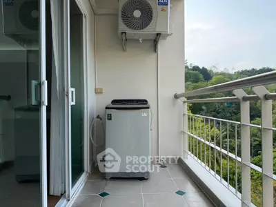 Charming balcony with scenic view and modern washing machine setup.