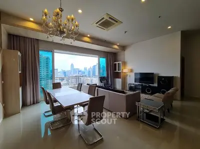 Luxurious living room with stunning city view and elegant chandelier