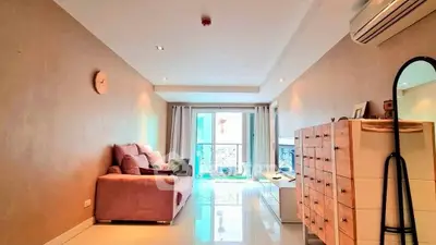 Spacious living room with modern decor and natural light