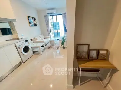 Modern living room with washing machine and balcony view
