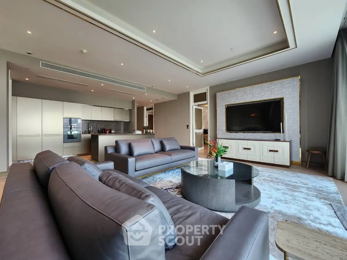 Luxurious modern living room with sleek furniture and open kitchen layout