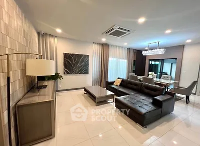 Spacious modern living room with elegant decor and open layout, perfect for entertaining.