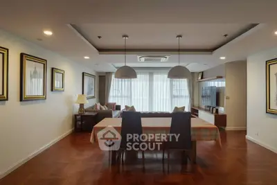 Spacious living room with elegant dining area and modern decor