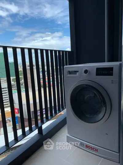 Modern balcony with city view and Bosch washing machine, perfect for urban living.