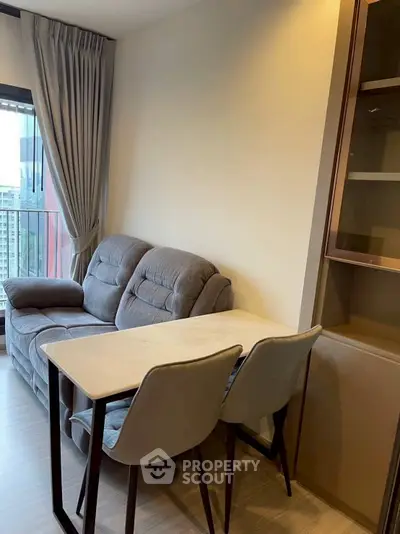 Cozy living room with modern furniture and city view from balcony