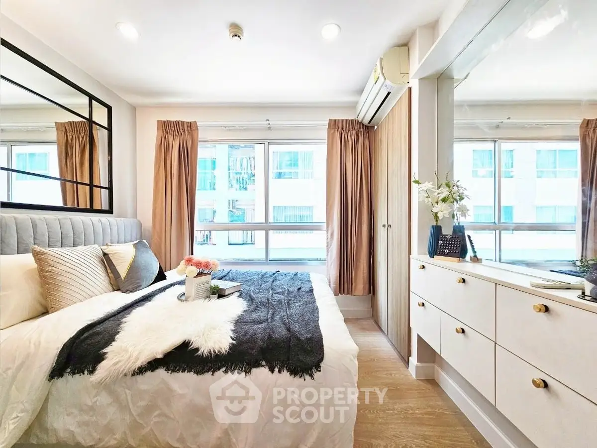 Bright and modern bedroom with stylish decor and ample natural light