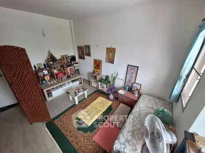 Cozy living room with spiritual decor and natural light