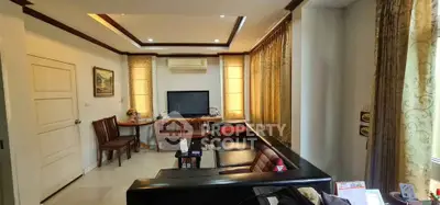 Spacious living room with elegant decor and ample natural light