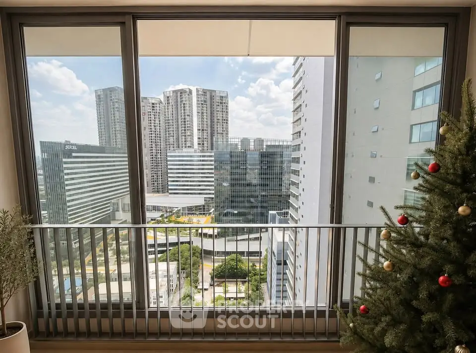 Stunning city view from modern apartment balcony with festive decor.