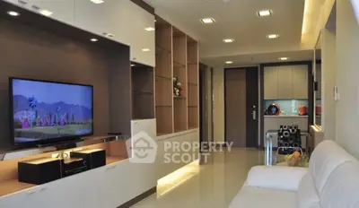 Modern living room with sleek furniture and built-in TV unit