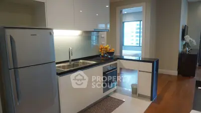 Modern kitchen with sleek design, featuring stainless steel appliances and elegant cabinetry.