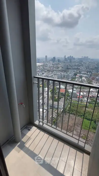 Stunning high-rise balcony with panoramic city views, perfect for urban living.