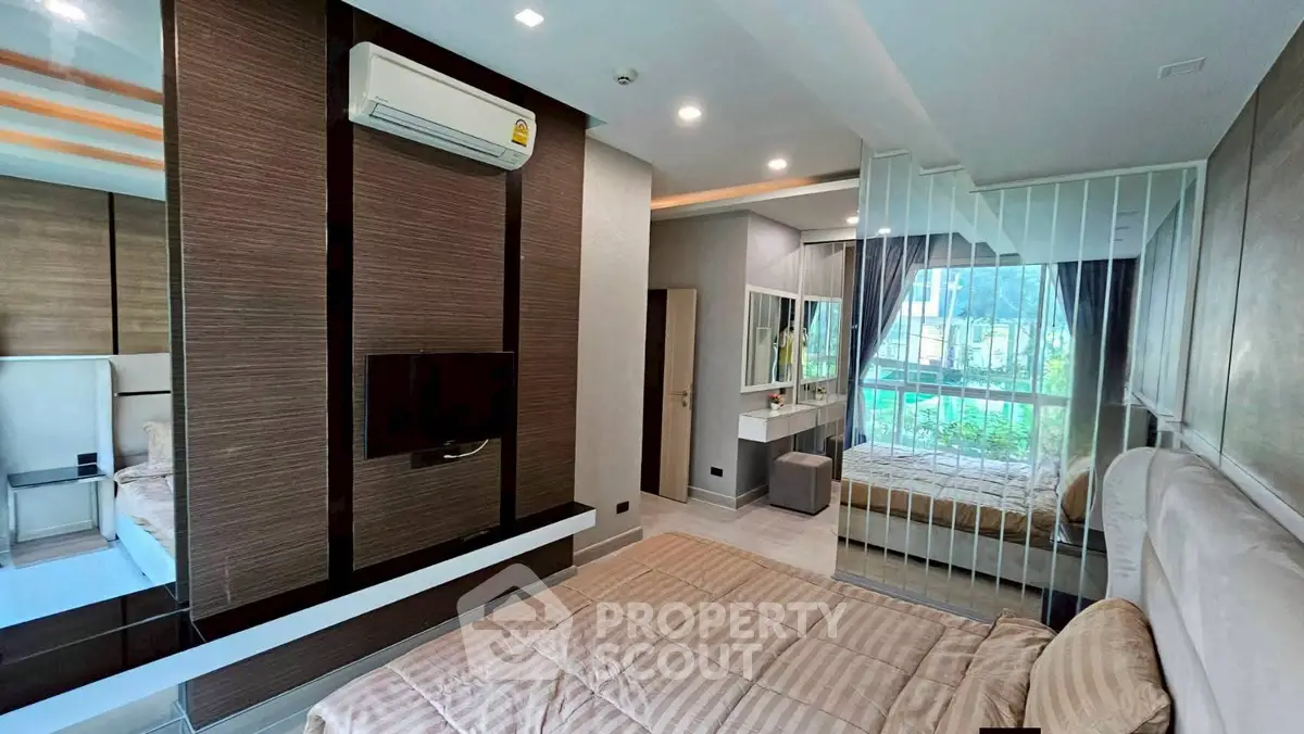 Modern bedroom with stylish decor and large window view