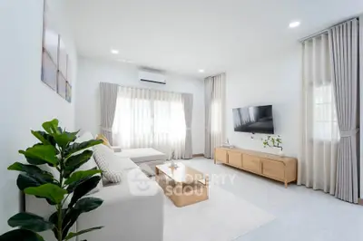 Spacious modern living room with elegant decor and natural light
