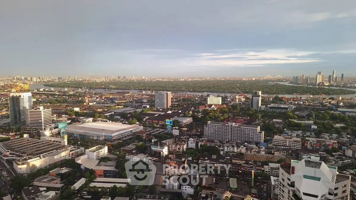 Stunning cityscape view from high-rise building showcasing urban skyline and distant horizon.