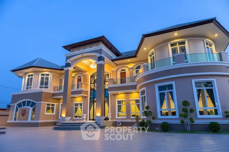 Luxurious mansion with elegant architecture and stunning evening lighting, showcasing grandeur and sophistication.