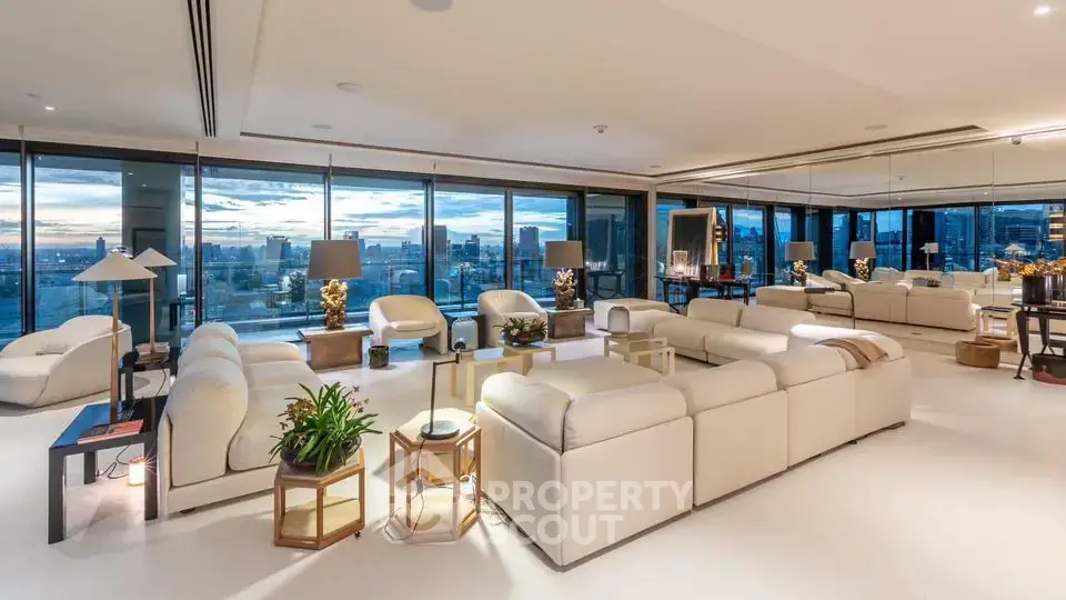 Luxurious spacious living room with panoramic city views and elegant modern decor.