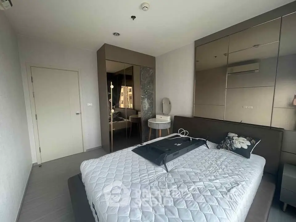 Modern bedroom with mirrored wardrobe and stylish decor