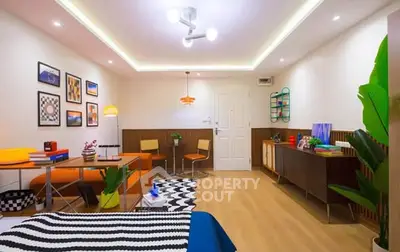 Stylish modern living room with vibrant decor and cozy seating area.
