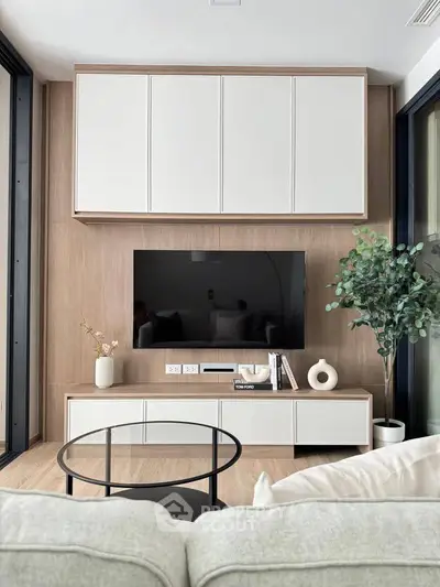 Modern living room with sleek TV setup and stylish decor