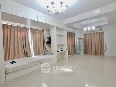 Spacious modern bedroom with elegant lighting and built-in storage