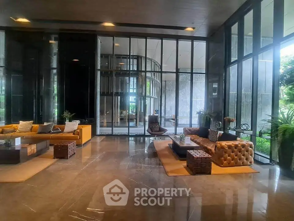 Luxurious modern lobby with elegant seating and floor-to-ceiling windows