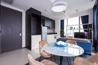 Modern open-plan living room with stylish furniture and natural light