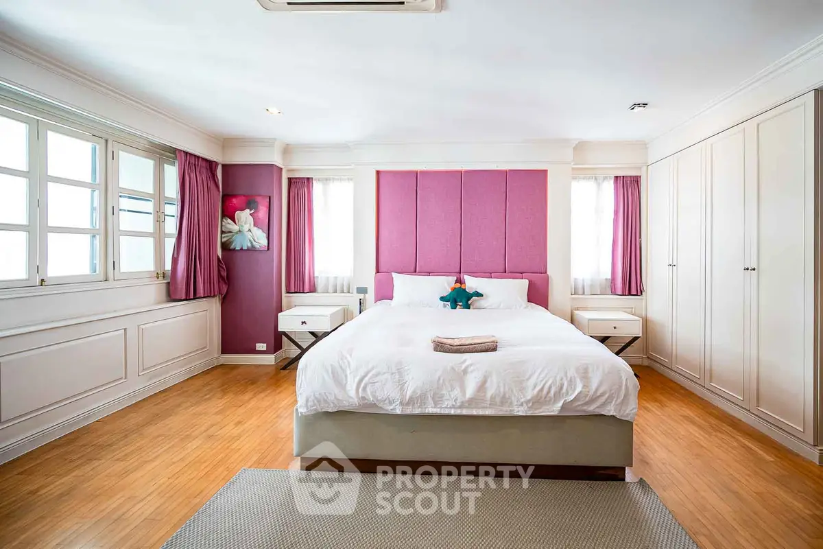 Spacious bedroom with elegant decor and natural light