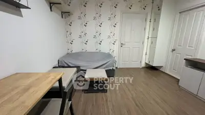 Cozy living room with modern decor and wooden flooring, perfect for relaxation and comfort.