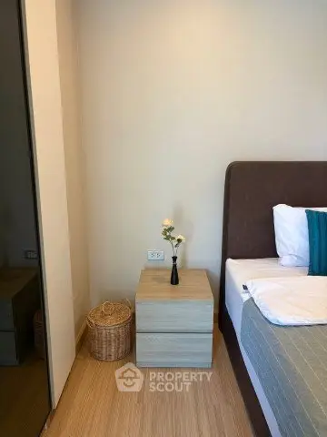 Cozy bedroom corner with modern nightstand and elegant decor