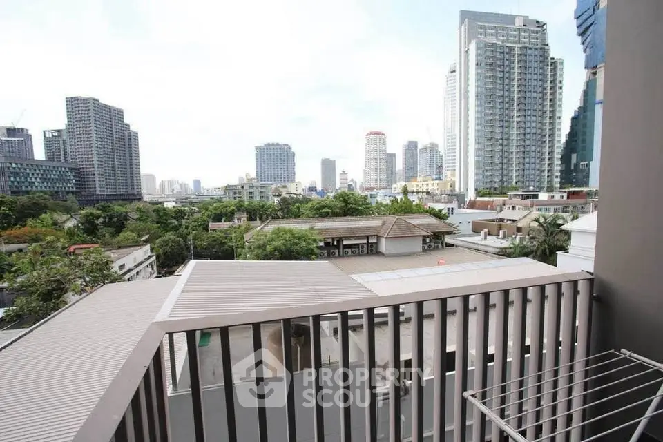 Stunning cityscape view from modern apartment balcony