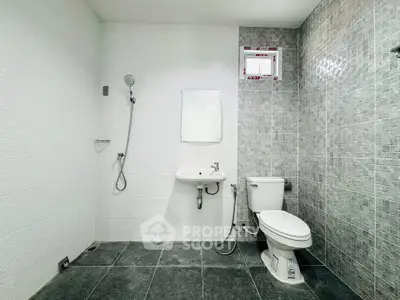 Modern bathroom with sleek tiles and minimalist fixtures