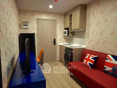 Charming compact living room with modern decor and vibrant accents