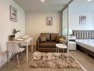 Modern studio apartment with cozy living area and stylish decor