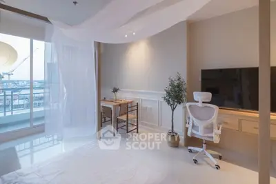 Modern bedroom with balcony view, stylish desk, and elegant decor