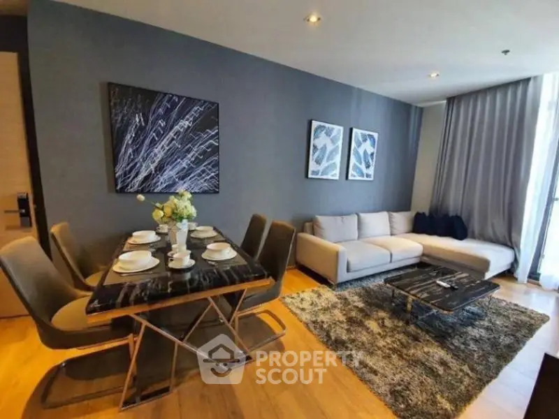 Modern living room with stylish dining area and cozy seating