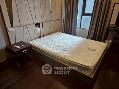 Modern bedroom with stylish design and large window for natural light