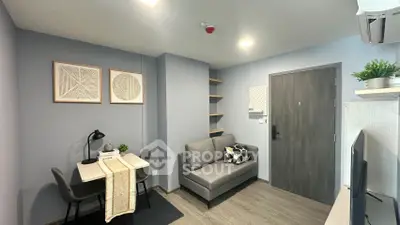 Modern living room with cozy sofa, stylish decor, and dining area in a contemporary apartment.