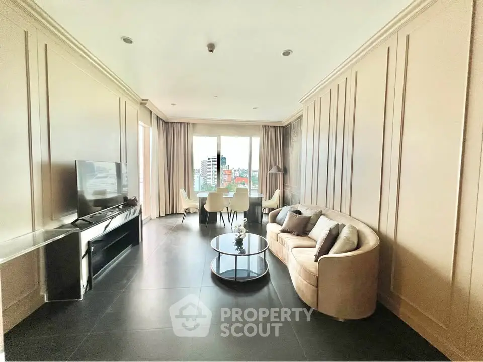 Spacious living room with modern decor and city view, perfect for urban living.