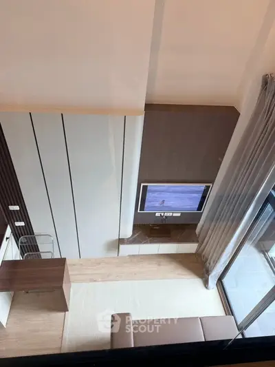 Modern living room with sleek design and balcony view