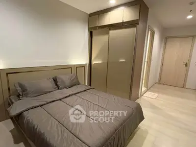 Modern bedroom with sleek design and built-in wardrobe, perfect for urban living.