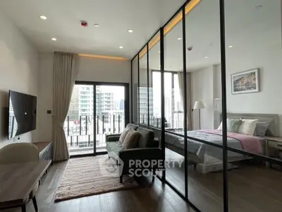 Modern studio apartment with glass partition and city view balcony