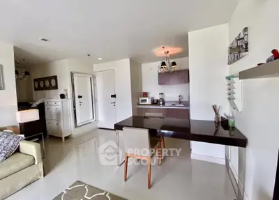 Modern open-plan living area with sleek kitchen and dining space