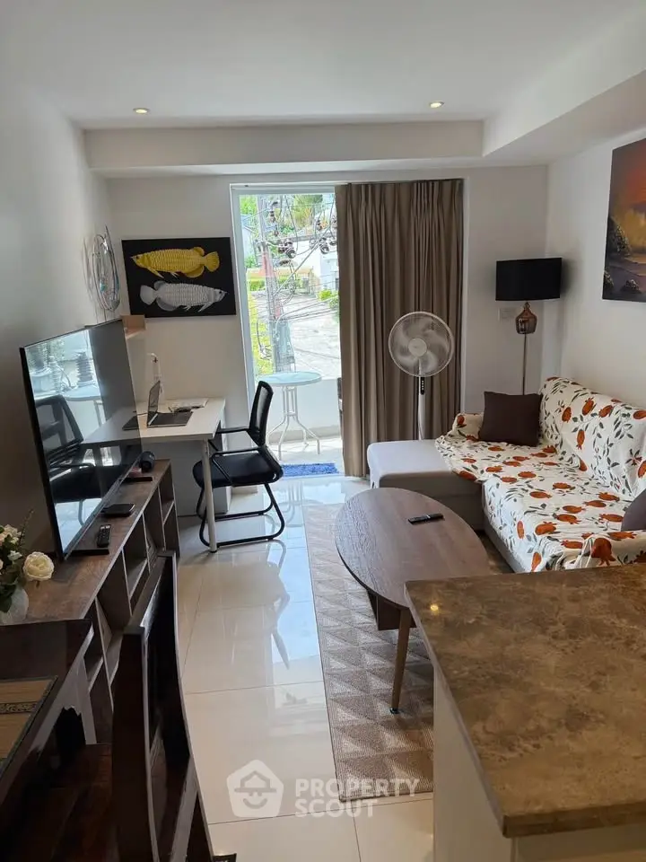 Charming living room with modern decor and natural light, perfect for relaxation and entertainment.