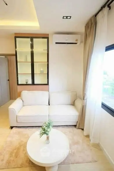 Bright and cozy living room with modern sofa and air conditioning